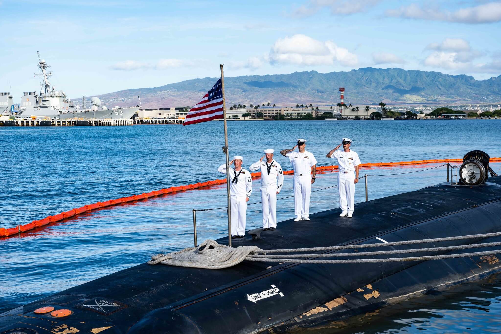 Sailors assigned to Virginia-class fast-attack submarine USS Missouri (SSN 780) fold the 24-star American Flag aboard the submarine