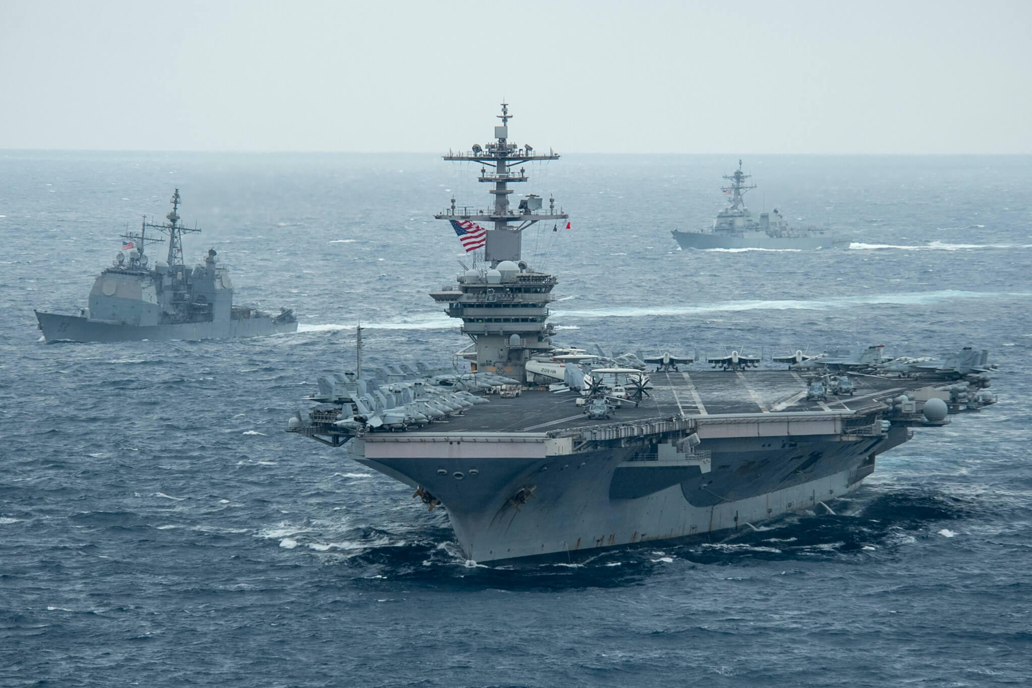 Lindley-French-The aircraft carrier USS Theodore Roosevelt in the front, the USS Bunker Hill left and guided-missile destroyer USS John Finn transit the Pacific Ocean in January 2021.