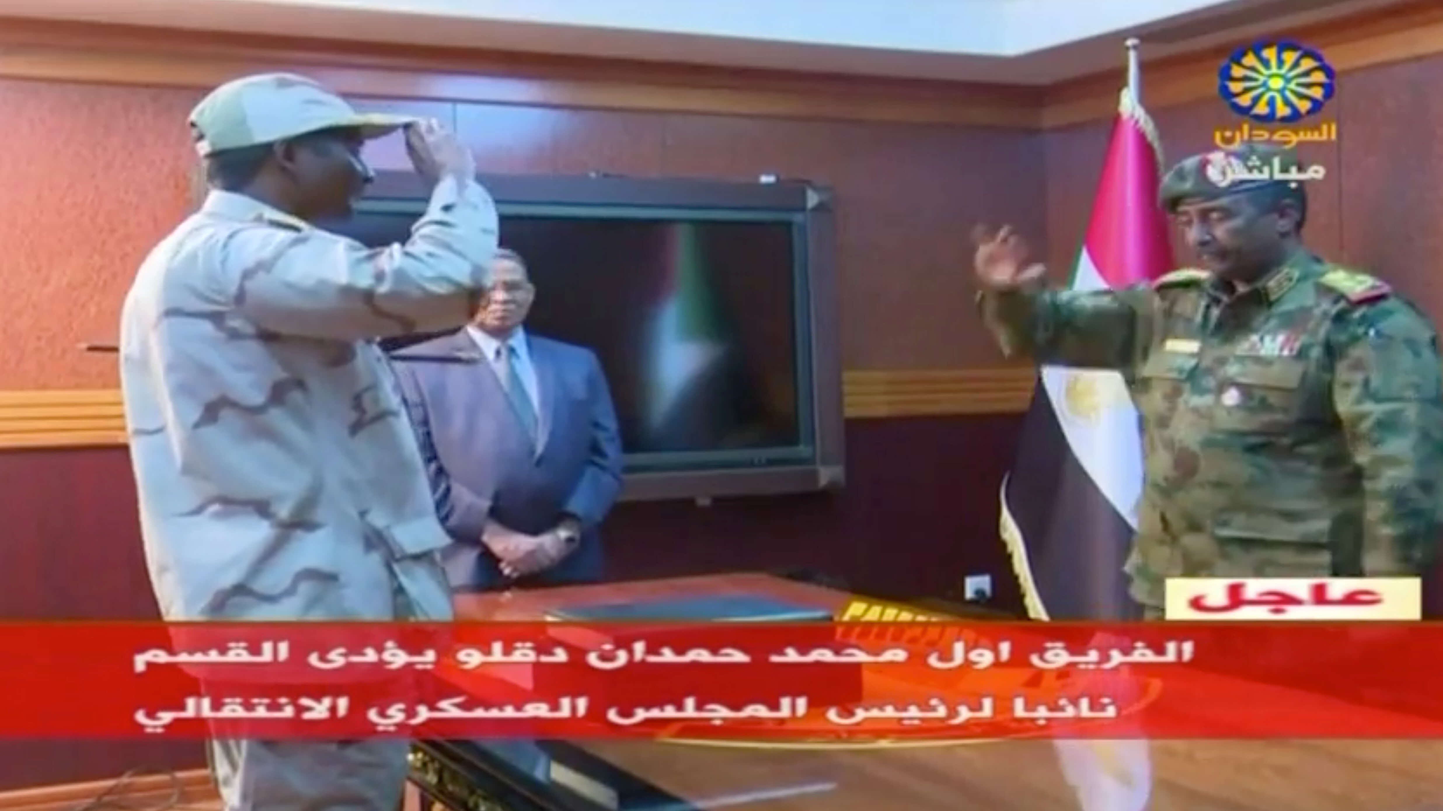 Sudan's general Mohamed Hamdan Dagalo, known as ‘Hemedti’, head of the Rapid Support Forces, is sworn-in as the appointed deputy of Sudan's transitional military council, standing before the head of transitional council, Lieutenant General Abdelfattah al-Burhan Abdelrahman (R) in Khartoum, Sudan on 13 April 2019. © Reuters